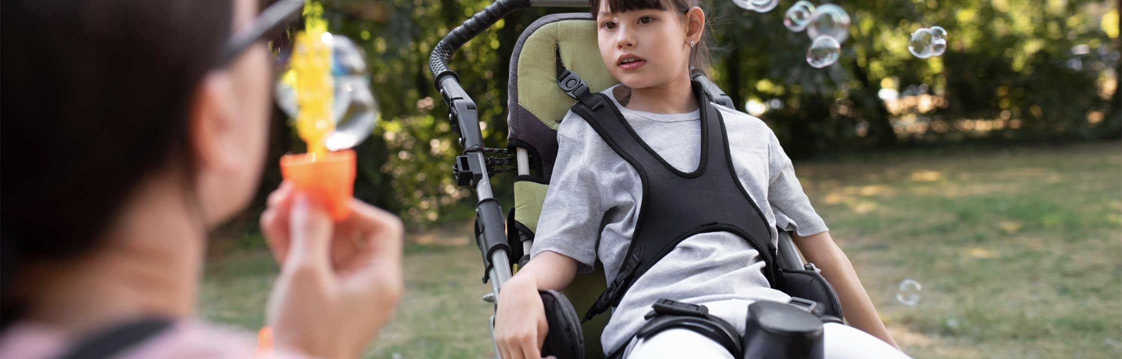 Young girl sat in her wheelchair