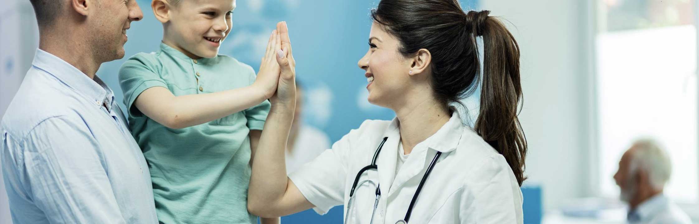 father holding child in a medical clinic