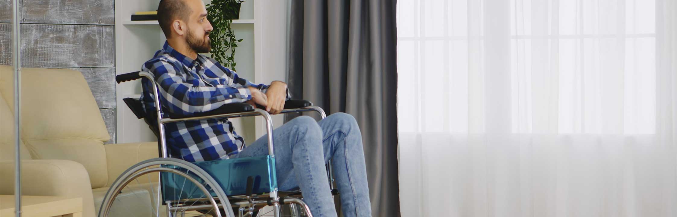 a man in wheelchair in residential setting